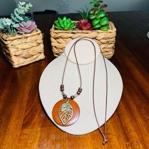Boho Chic Wooden Disc and Bronze Leaf Pendant Necklace on 31” Brown Cord.